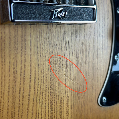 Wear below bridge of Used 1978 Peavey T-60 Natural.