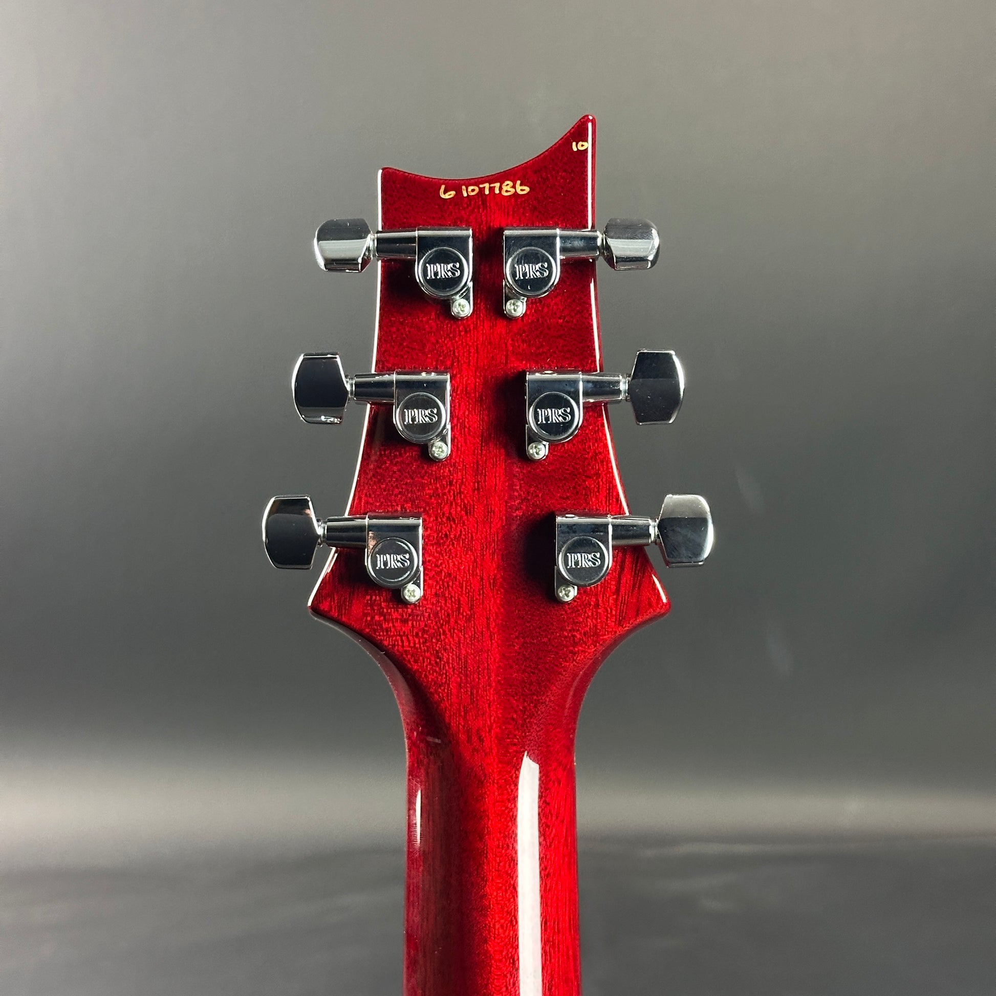 Back of headstock of Used 2006 PRS Custom 24 10 Top Ruby Red.