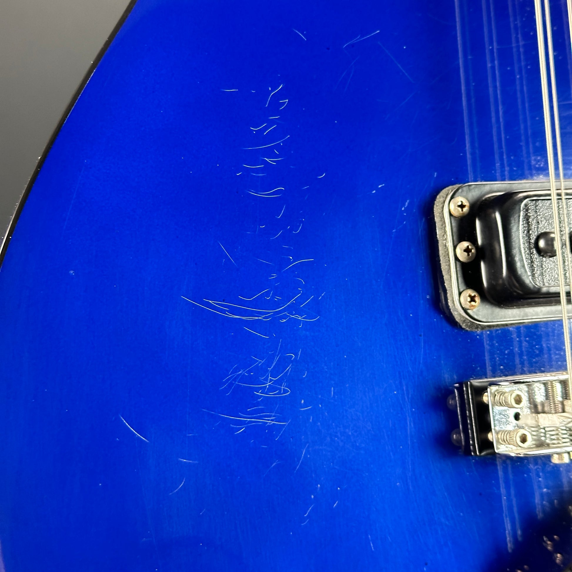 Scratches on body of Used 1988 Rickenbacker 620 Midnight Blue.