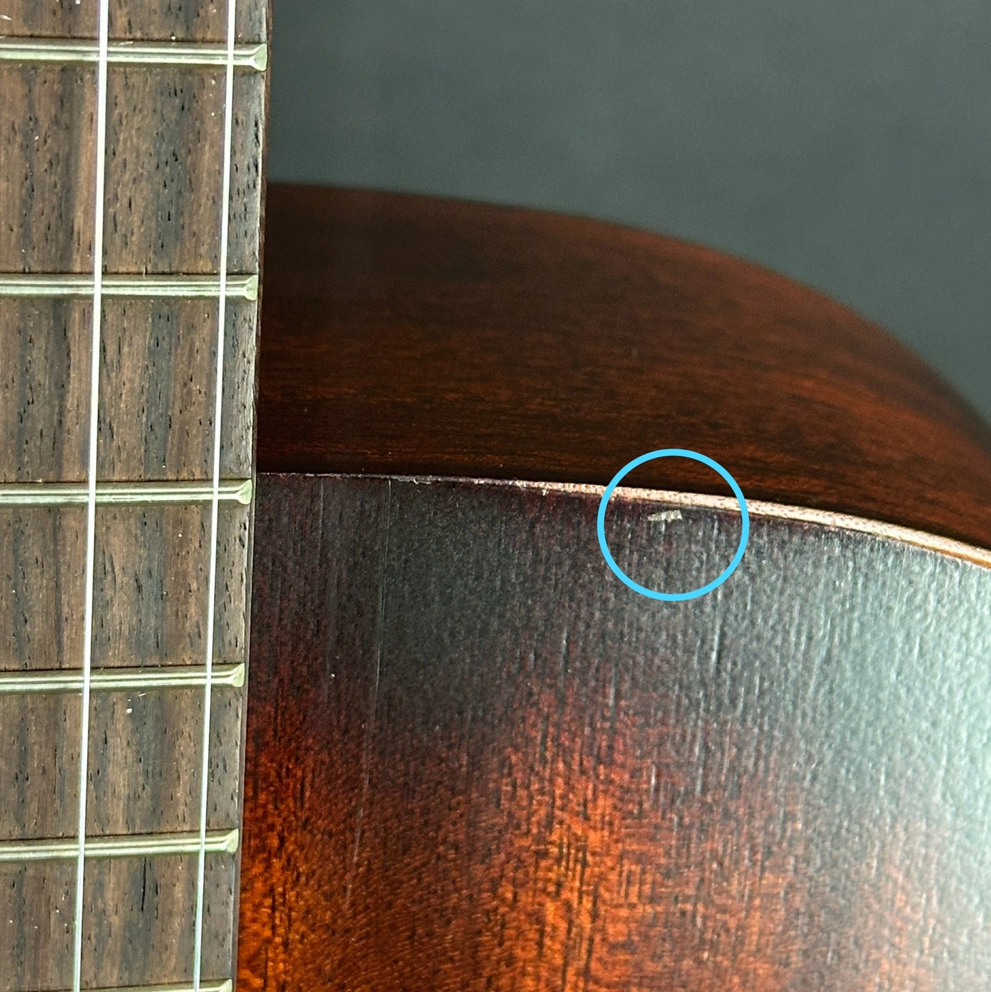 Small ding on top edge of Used Martin 000-15M Streetmaster.