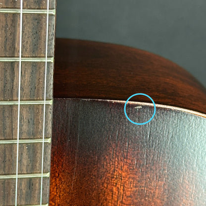 Small ding on top edge of Used Martin 000-15M Streetmaster.