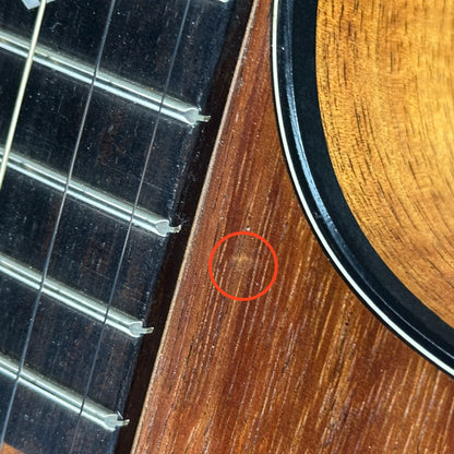 Ding near cutaway of Used Taylor 224ce-K DLX.