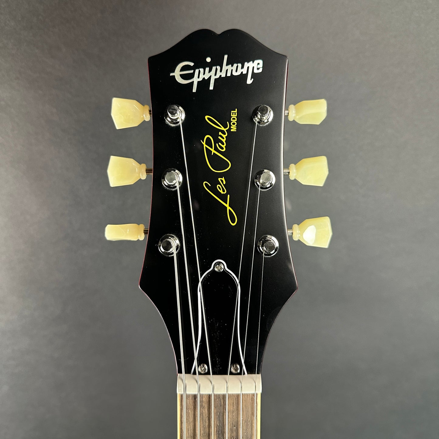 Front of headstock of Used Epiphone Limited 1959 Les Paul Standard Aged Dark Cherry Burst.