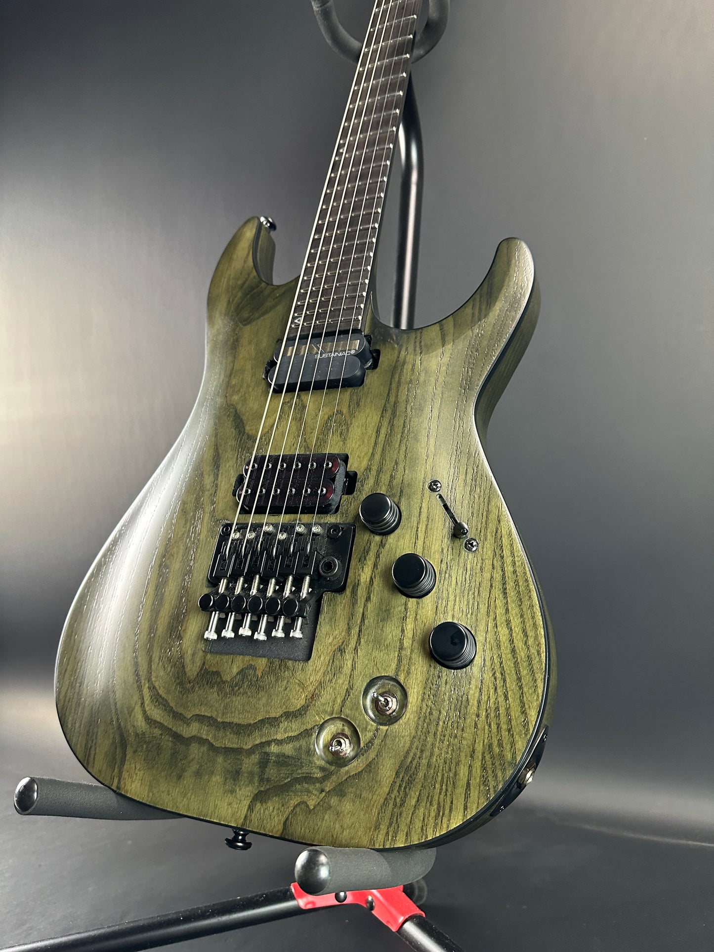 Front angle of Used Schecter C1 Apocalypse Ash Green Sustainer.