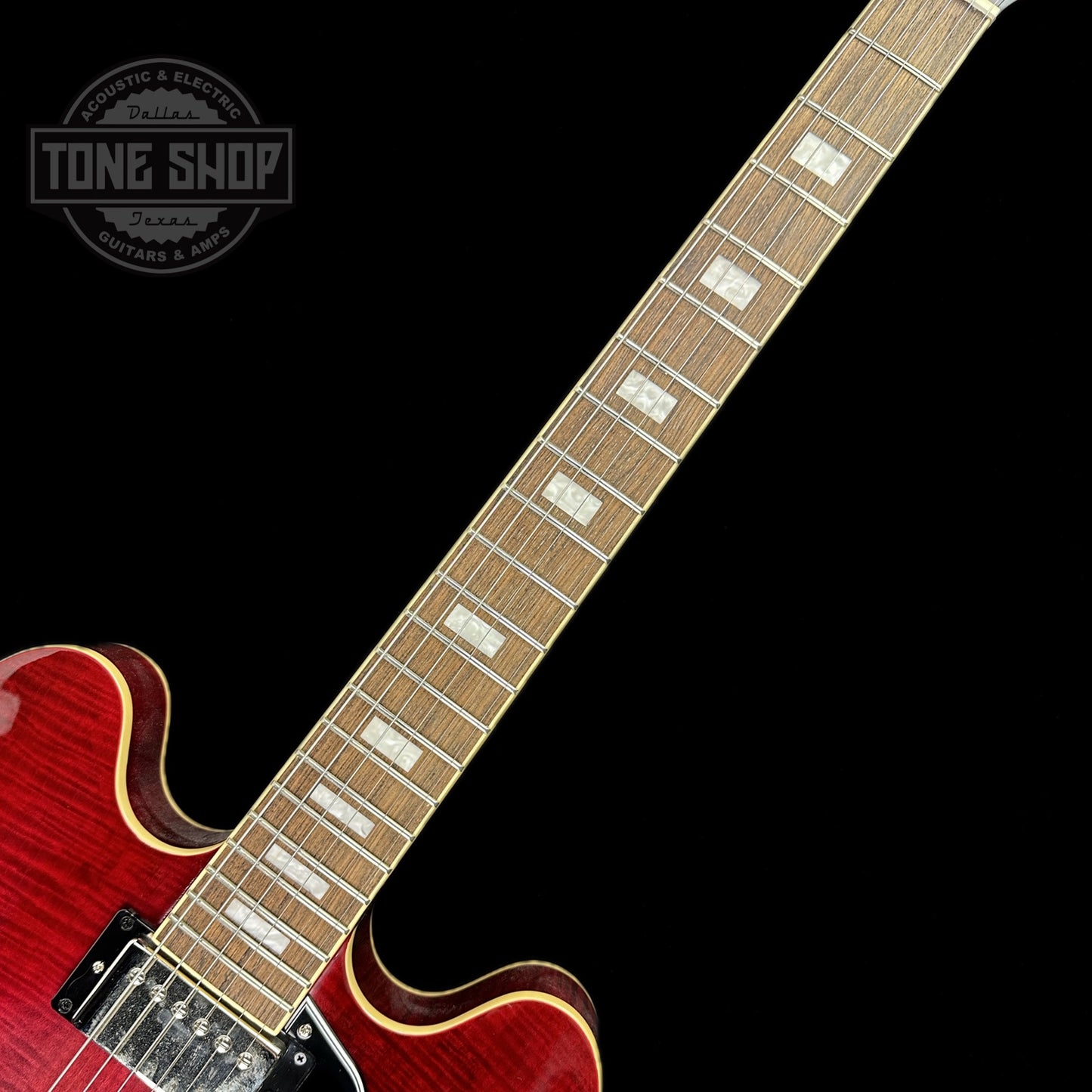 Fretboard of Used Epiphone ES-335 Figured Limited Raspberry Burst.