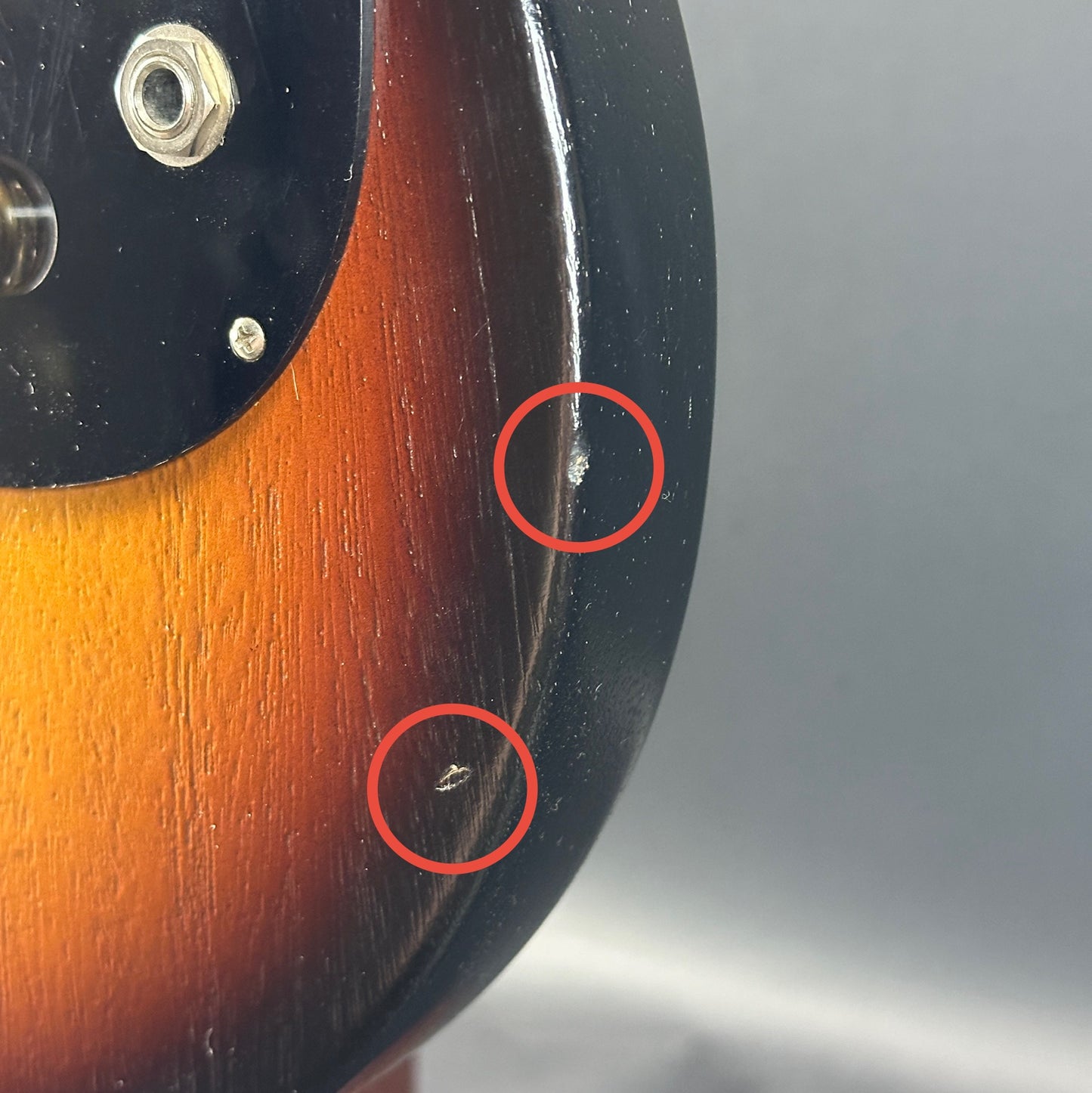 Two dings on front of Used Gibson Melody Maker Sunburst.