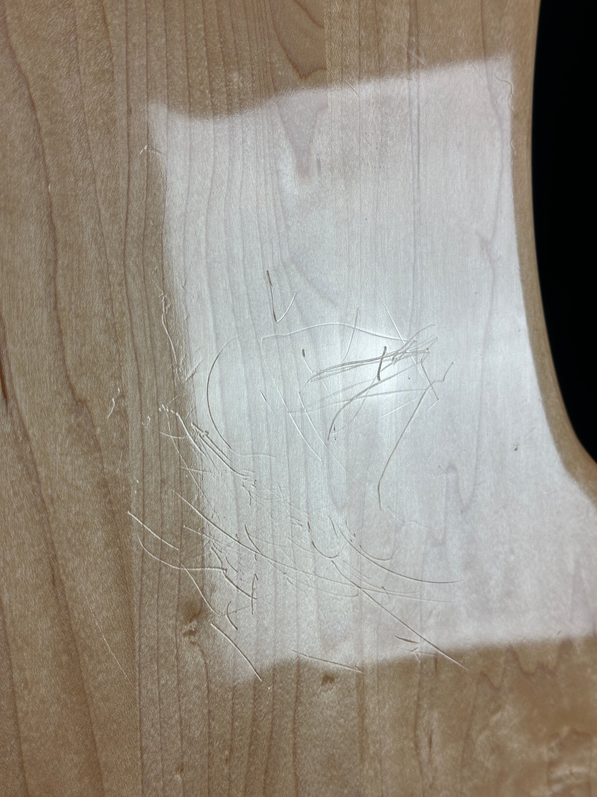 Scratches on back of Used 2004 Rickenbacker 4003 Natural.