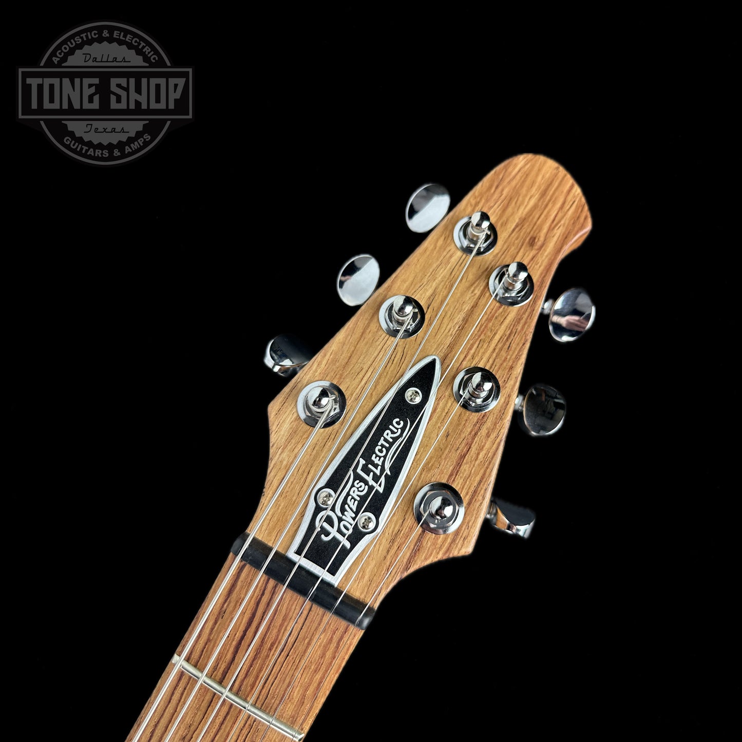 Front of headstock of Powers Electric A-Type Crayon Gray PF42 Firestripe Ebony Neutral CamTail.