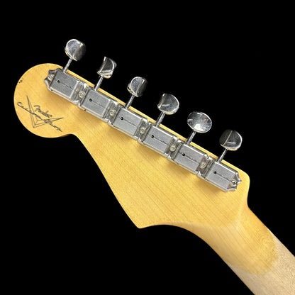 Back of headstock of Fender Custom Shop Postmodern Strat RW Journeyman Relic w/Closet Classic Hardware Aged Black.