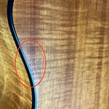 Scratches on back edge of Used Taylor 224ce-K DLX.