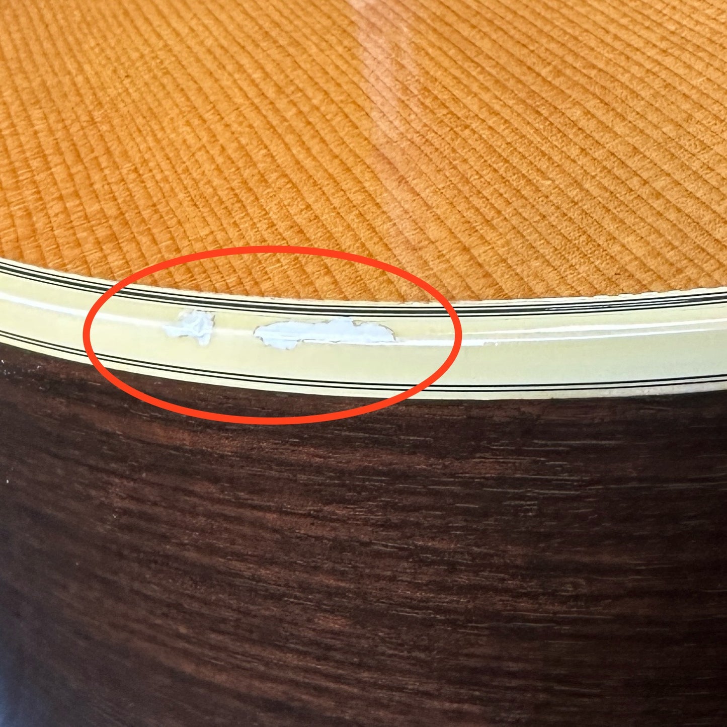 Chip in binding on Used Guild D-35.