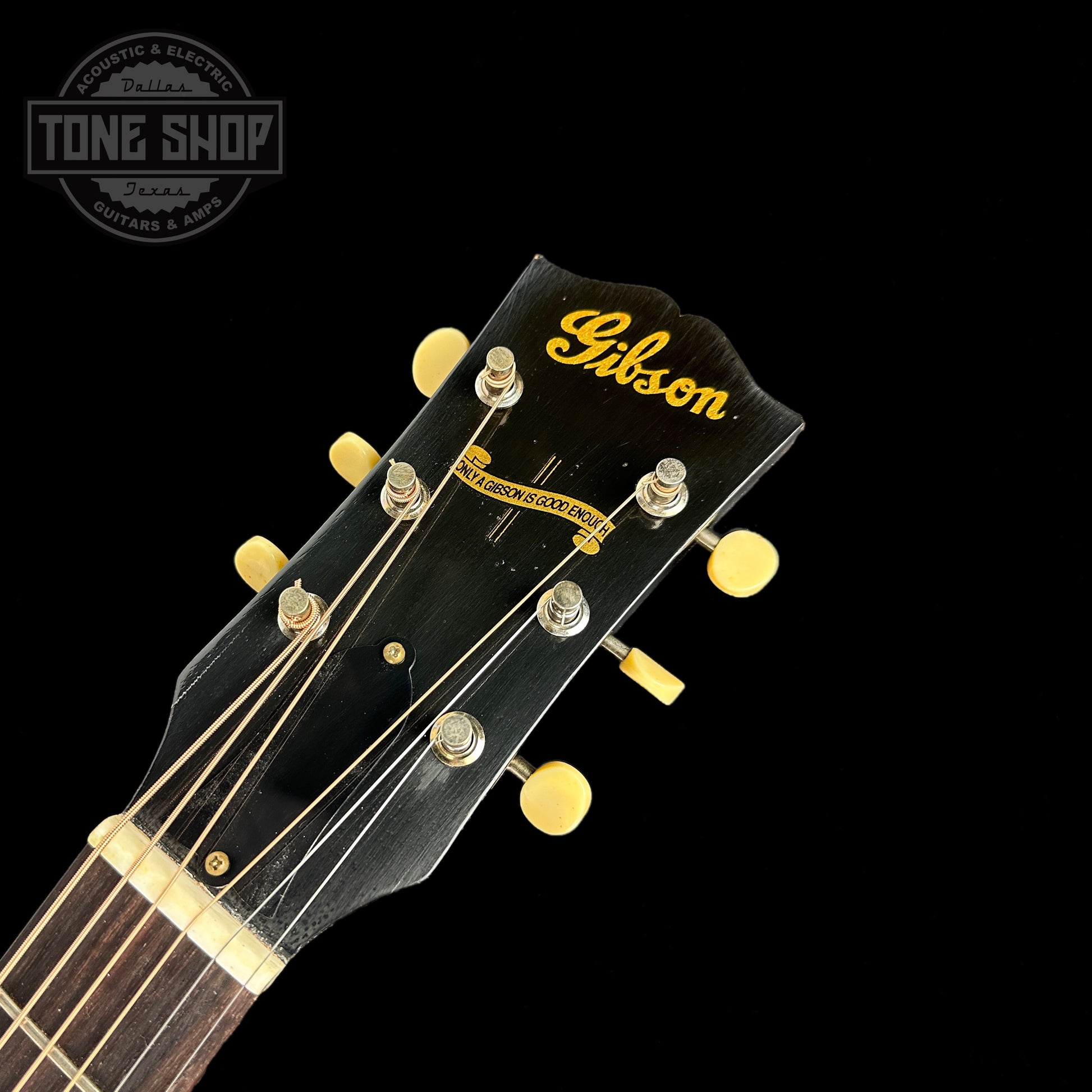 Front of headstock of Gibson Custom Shop M2M 1942 Banner J-45 Murphy Lab Light Aged Ebony.