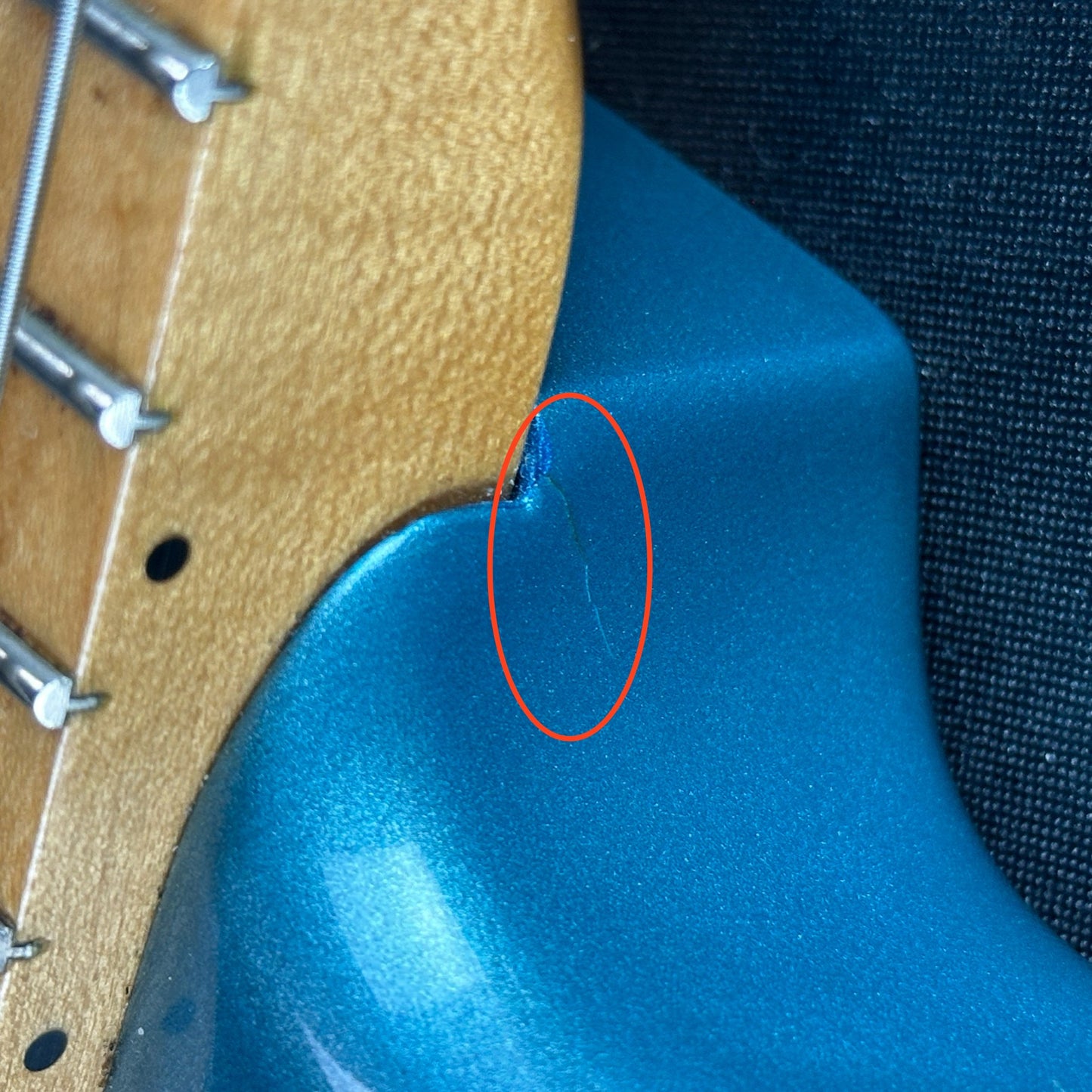 Damage near neck joint of Used Fender Player Strat Blue Left Handed.