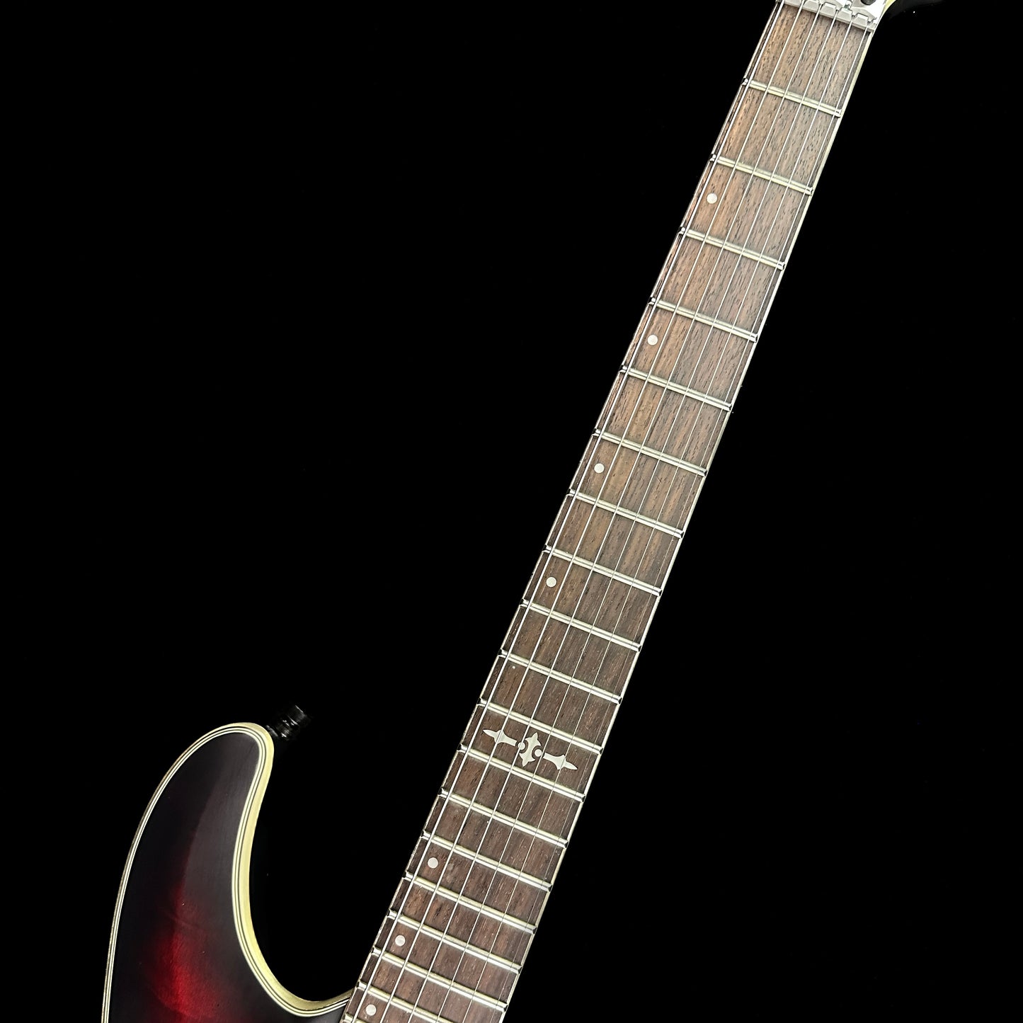 Fretboard of Used Schecter C1 FR Platinum Sustainer Crimson Red Burst.