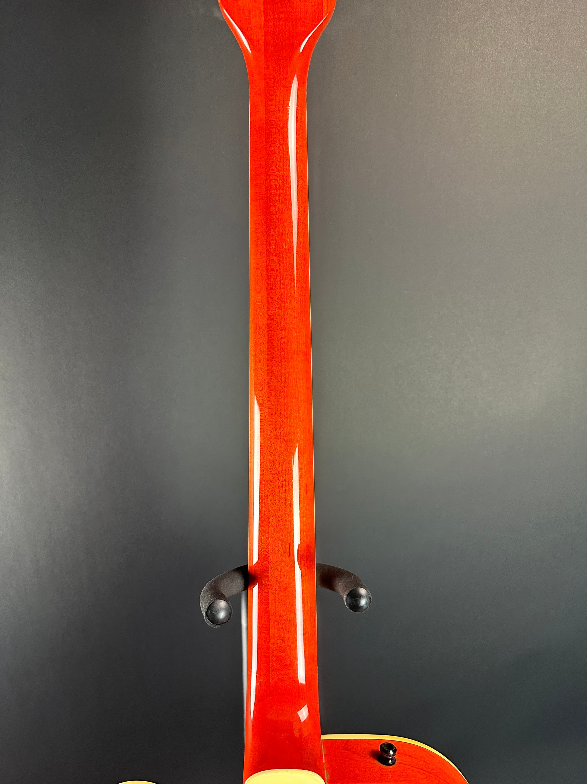 Back of neck of Used 1991 Gretsch G6119B Broadcaster Bass Orange.