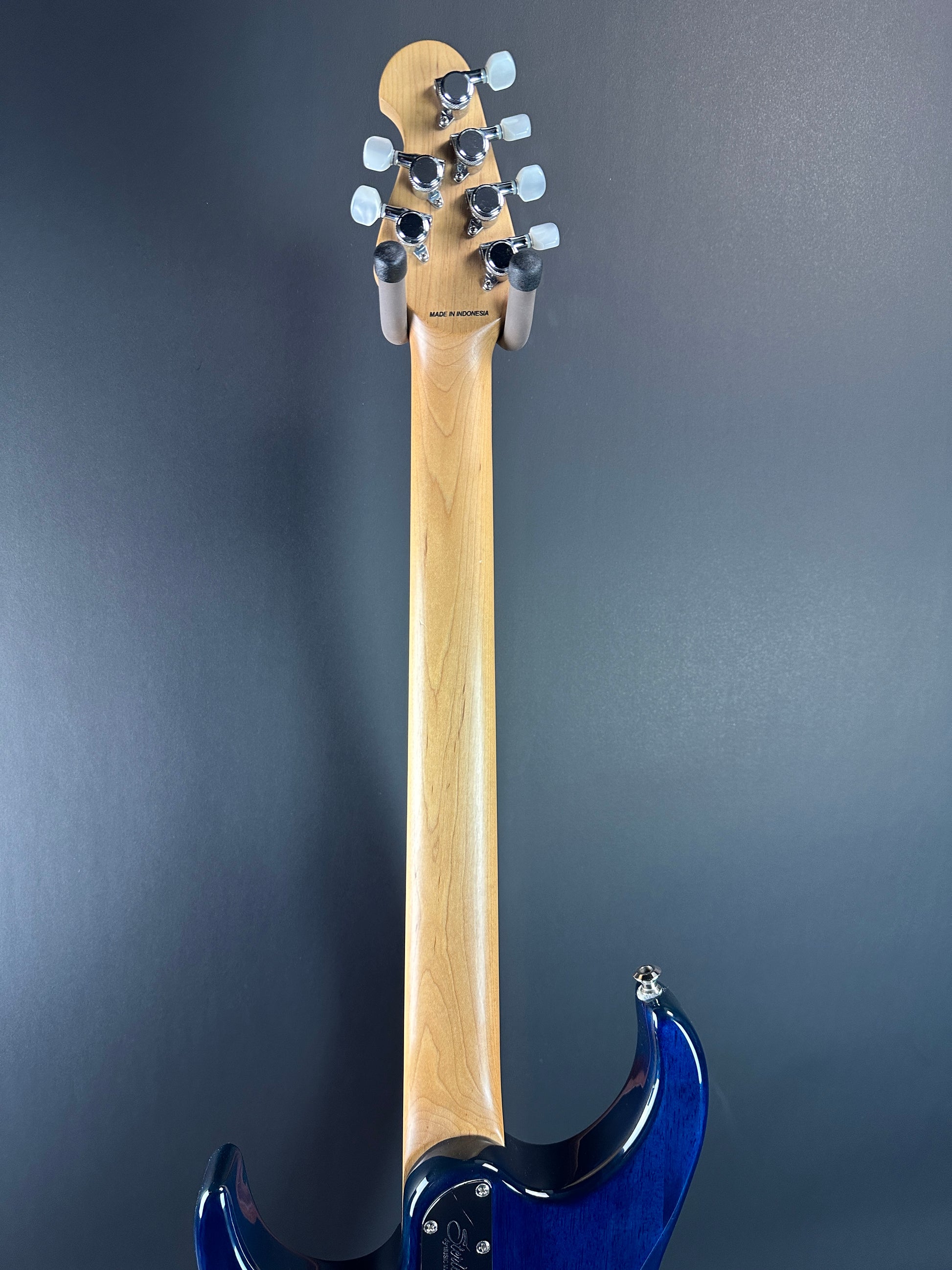 Back of neck of Used Sterling by MusicMan John Petrucci Quilt Top Trans Blue.