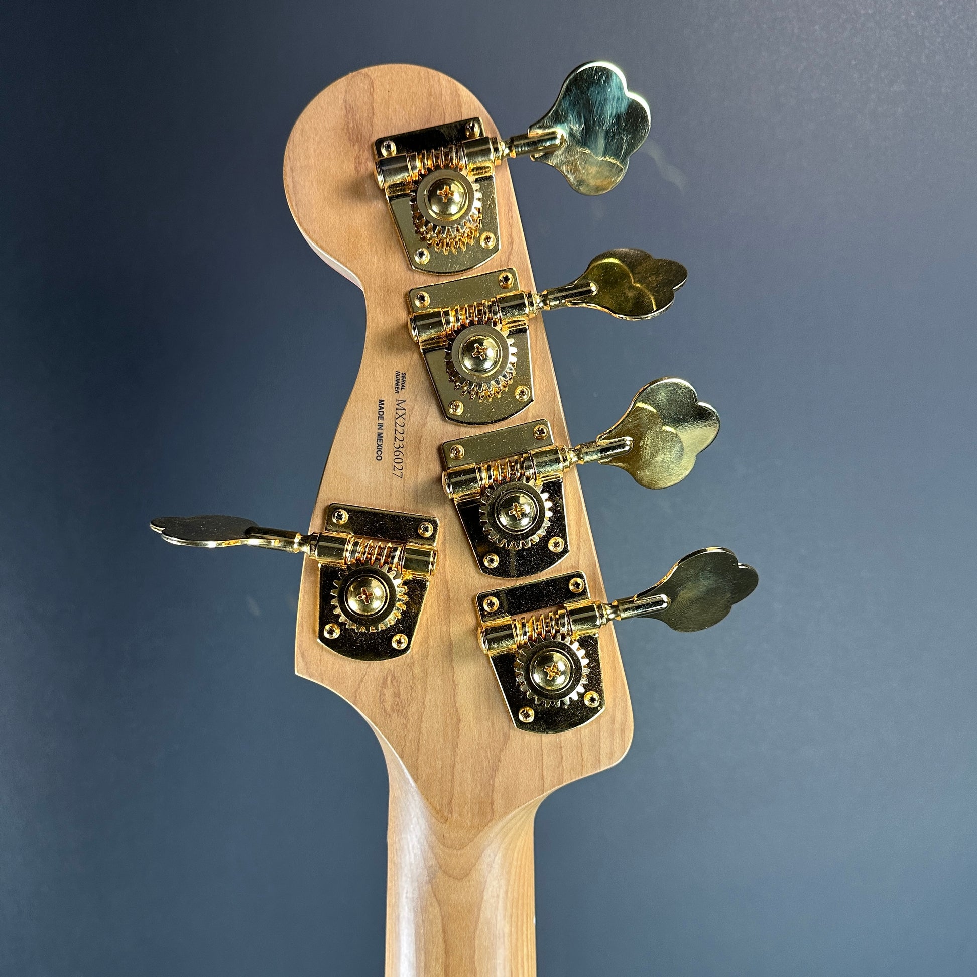 Back of headstock of Used Fender MonoNeon Jazz Bass.