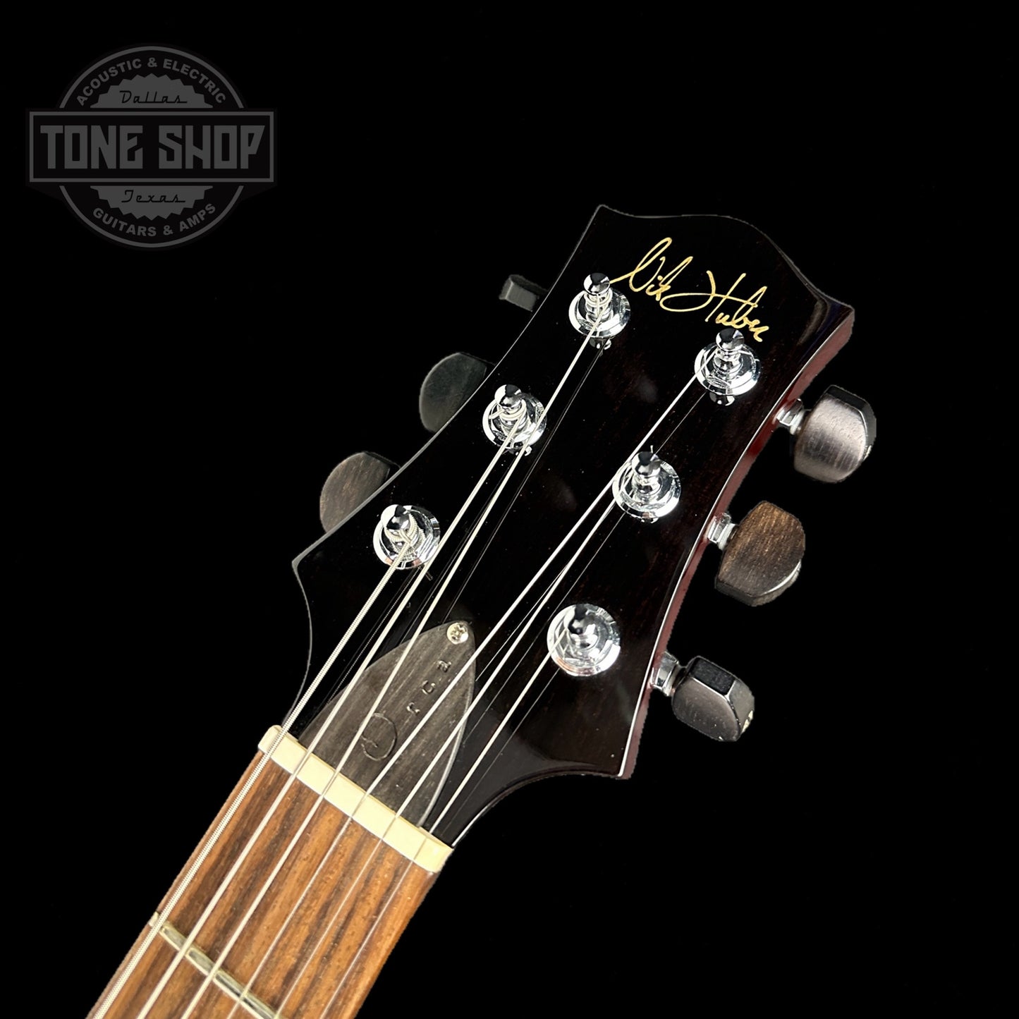 Front of headstock of Used Nik Huber Orca Gold Top.