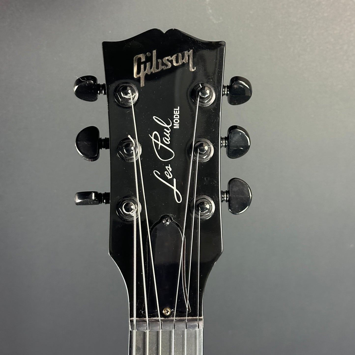 Front of headstock of Used Gibson Les Paul Studio Dark Ebony.