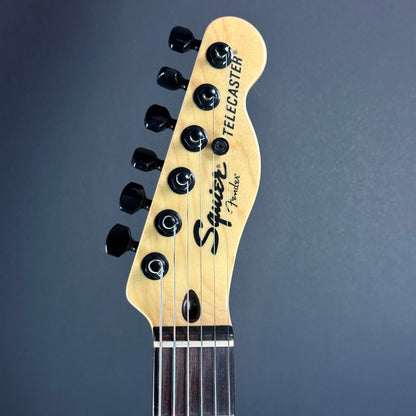 Front of headstock of Used Squier Jim Root Tele White.