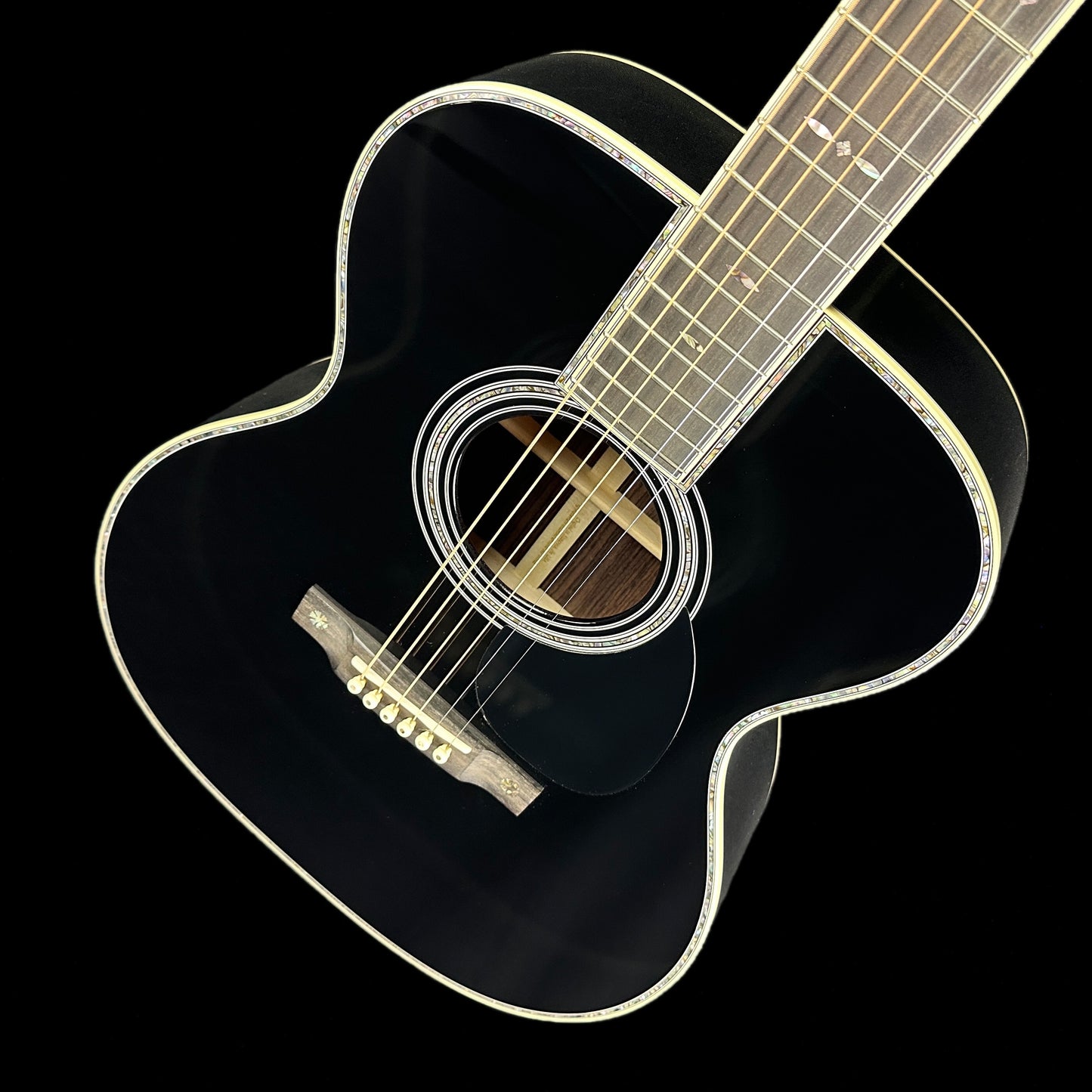 Front angle of Martin Custom Shop OM-42 Black Sitka/EIR.