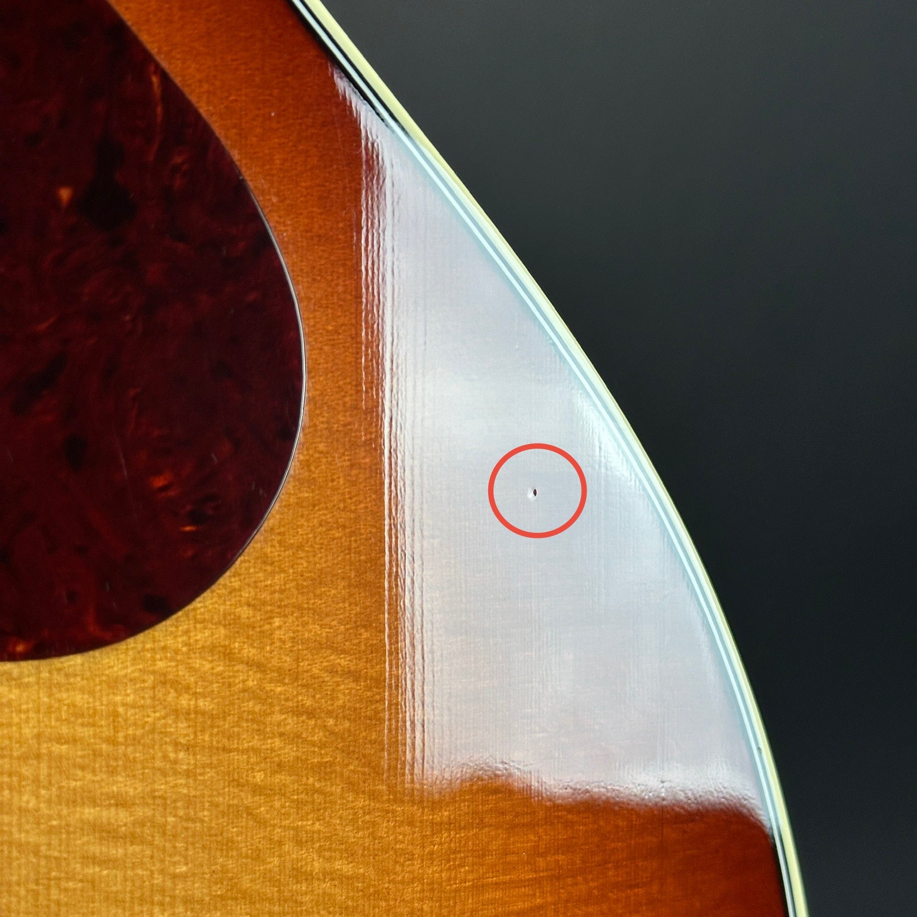 Ding on body of Used Gibson SJ-200 Studio Rosewood Burst.