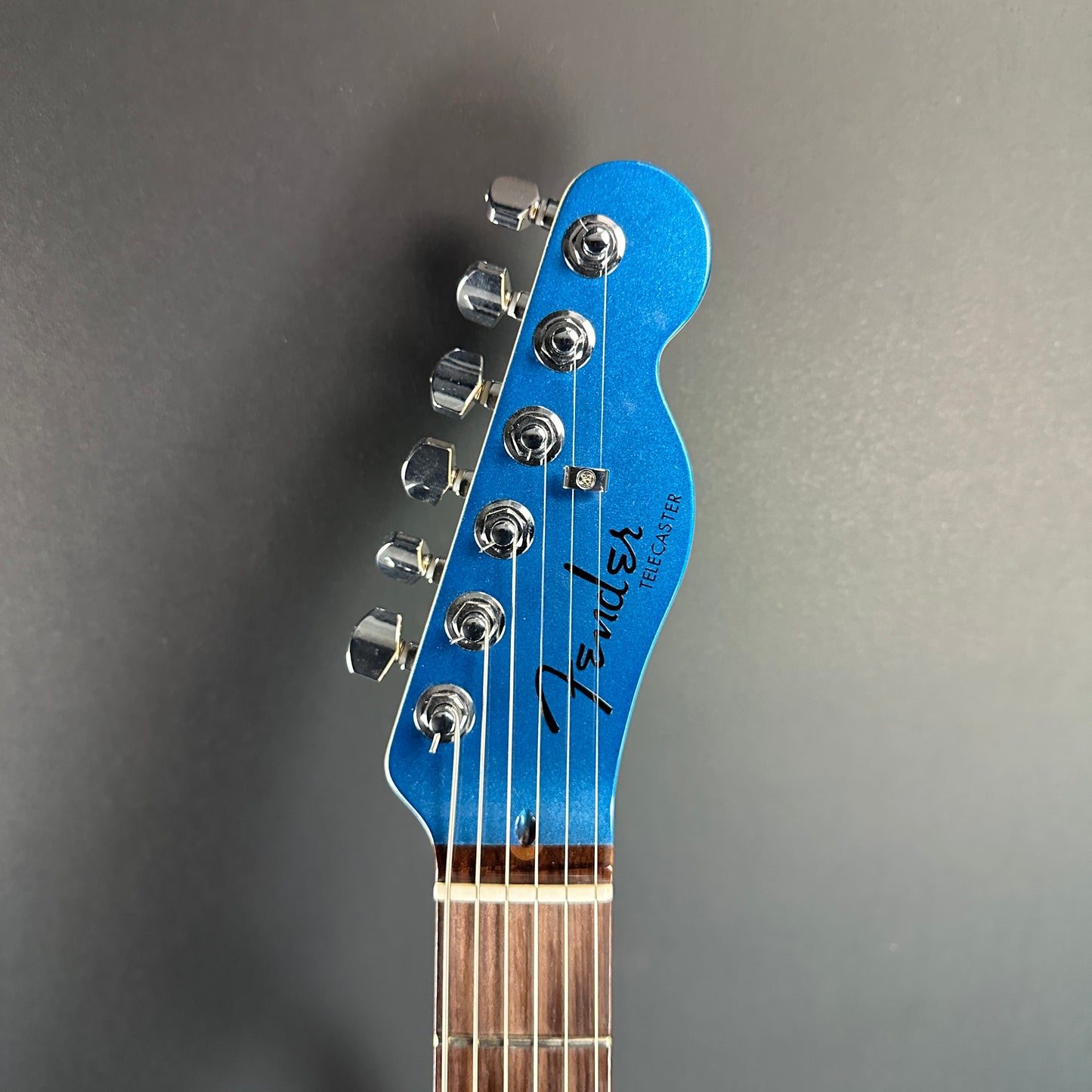 Front of headstock of Used Fender American Showcase Telecaster Skyburst.