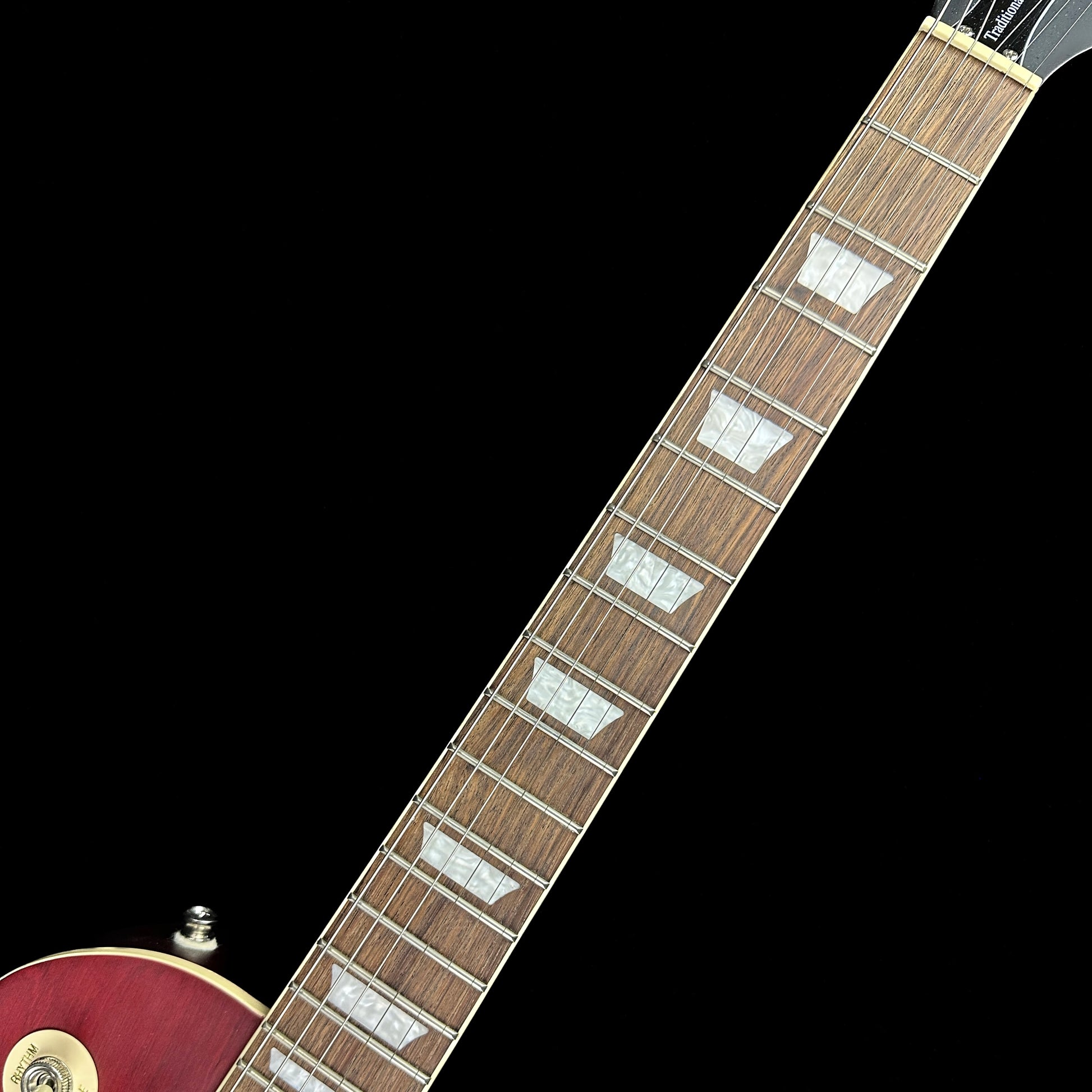 Fretboard of Used Epiphone Traditional Pro IV Les Paul Worn Wine Red.