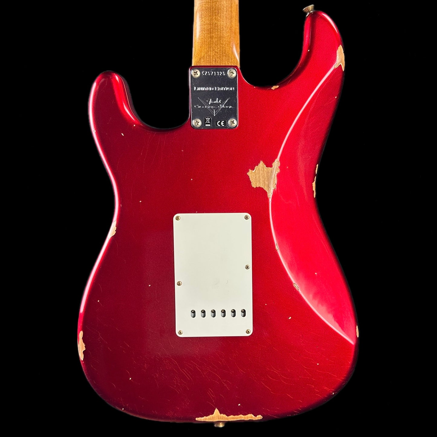 Back of body of Fender Custom Shop Limited Edition '63 Strat Relic Aged Candy Apple Red.