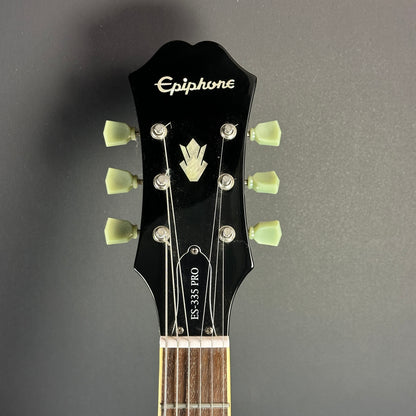 Front of headstock of Used Epiphone ES-335 Pro Burst.