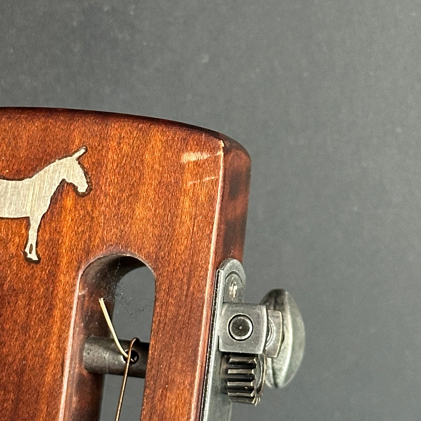 Scratch on front of headstock of Used Mule Resonator Guitar.