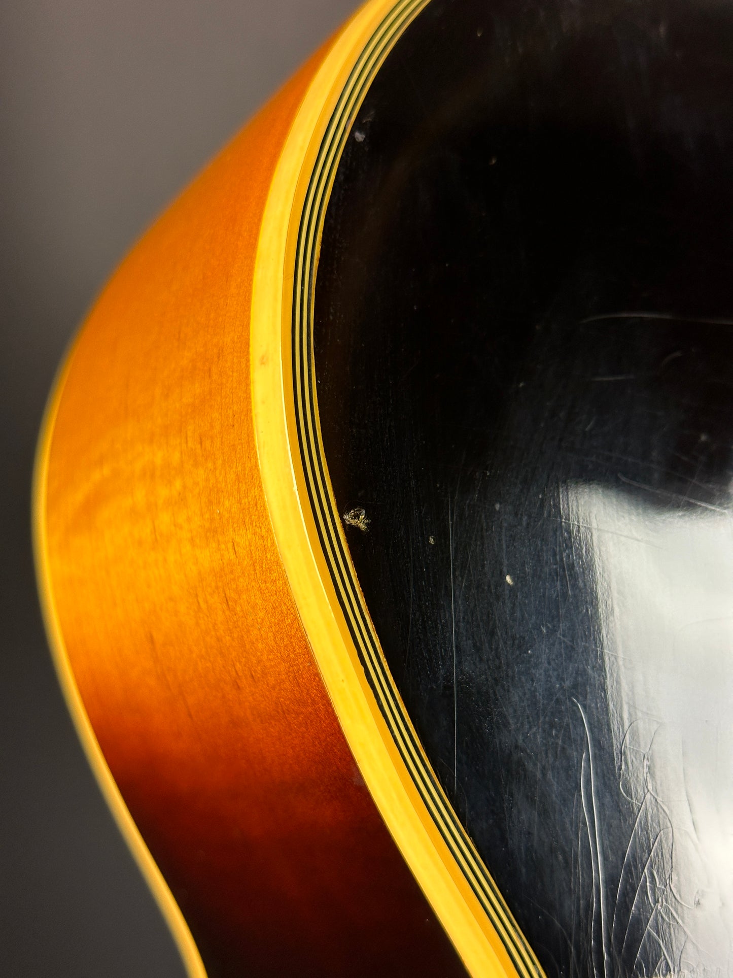 Wear on body of Vintage 1954 Gibson SJ-200 Sunburst.