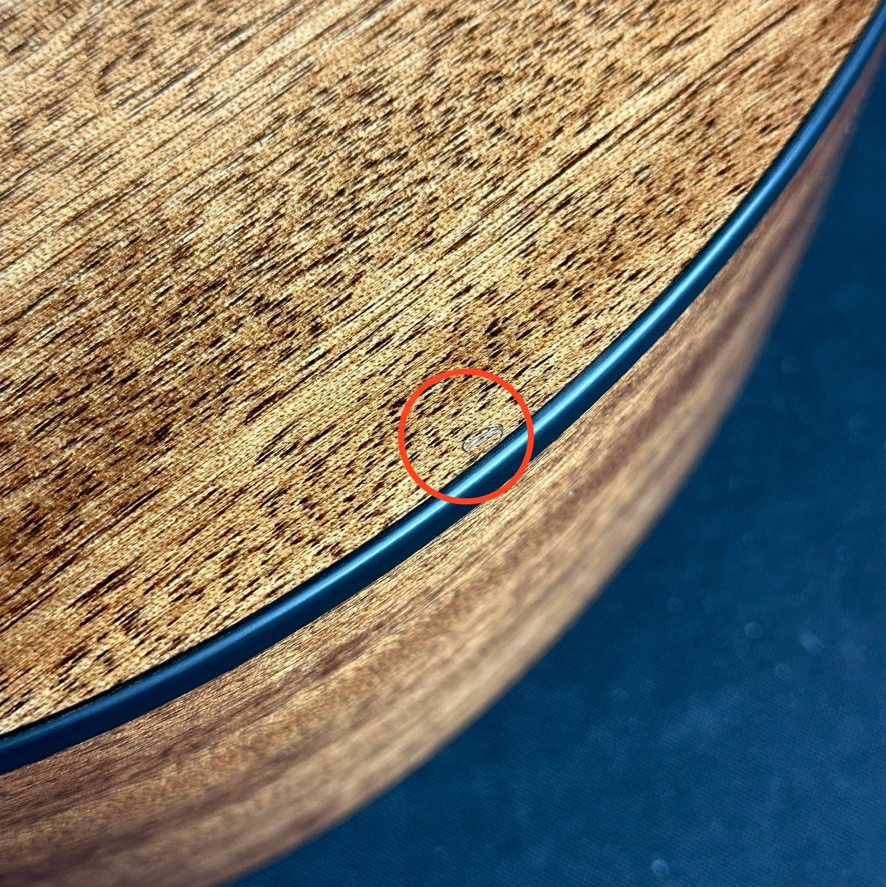 Mark on back edge of Used PRS SE AX20e Acoustic Natural.