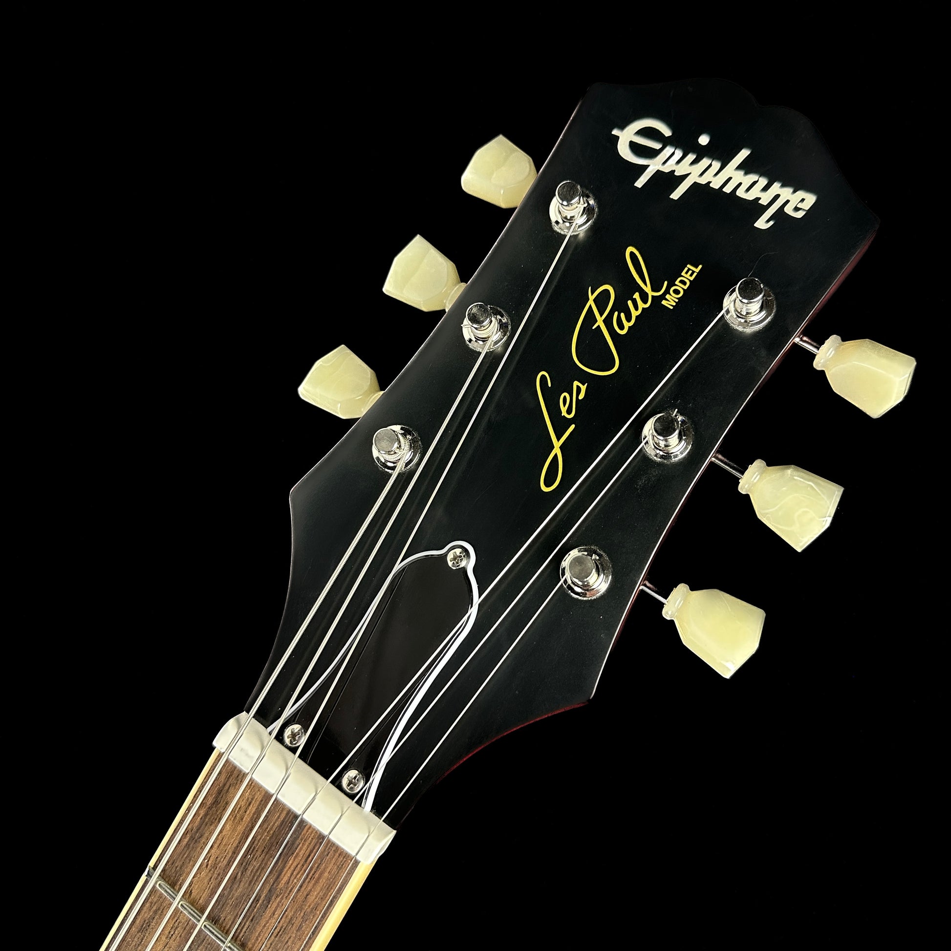 Front of headstock of Used Epiphone Limited 1959 Les Paul Standard Aged Dark Cherry Burst.