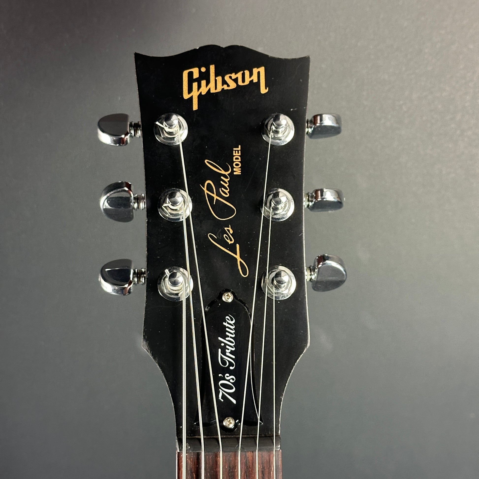 Front of headstock of Used Gibson Les Paul 70's Tribute Gold Top.