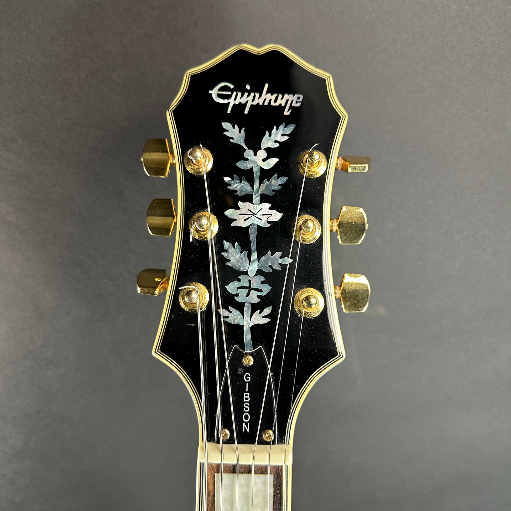 Front of headstock of Used Epiphone Emperor.