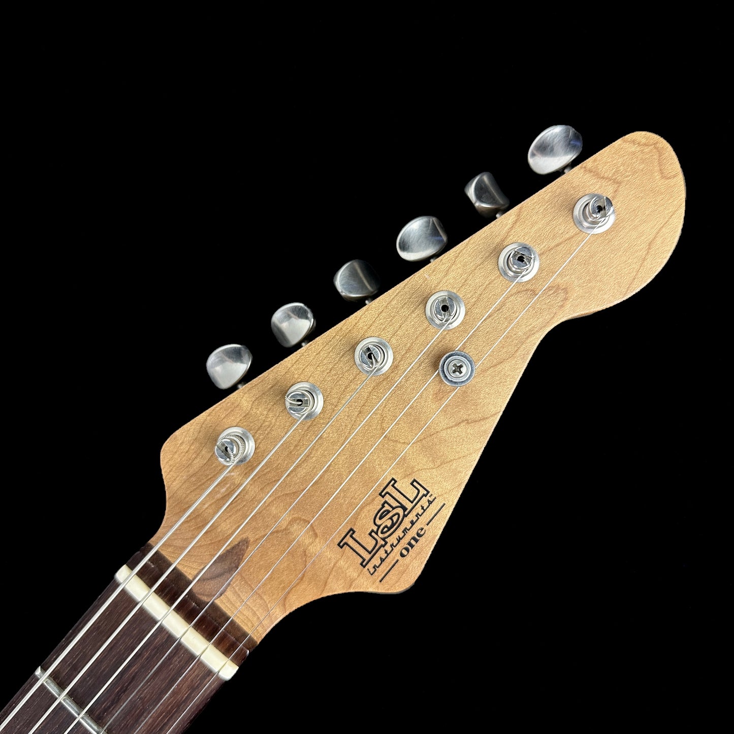 Front of headstock of Used LSL Saticoy Fiesta Red.