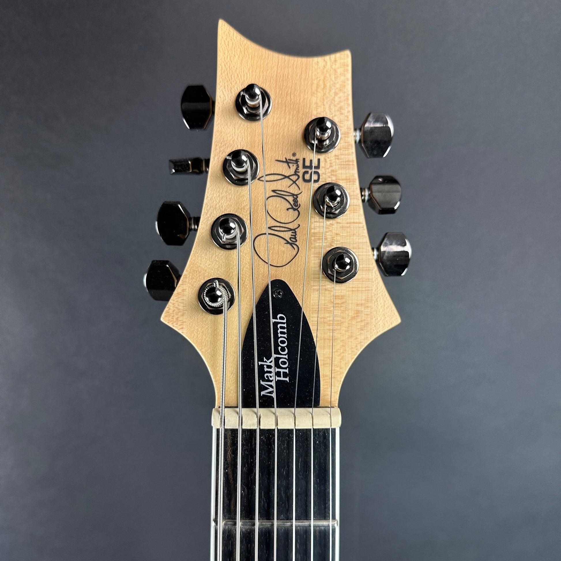 Front of headstock of Used PRS SE Mark Holcomb SVN Walnut.