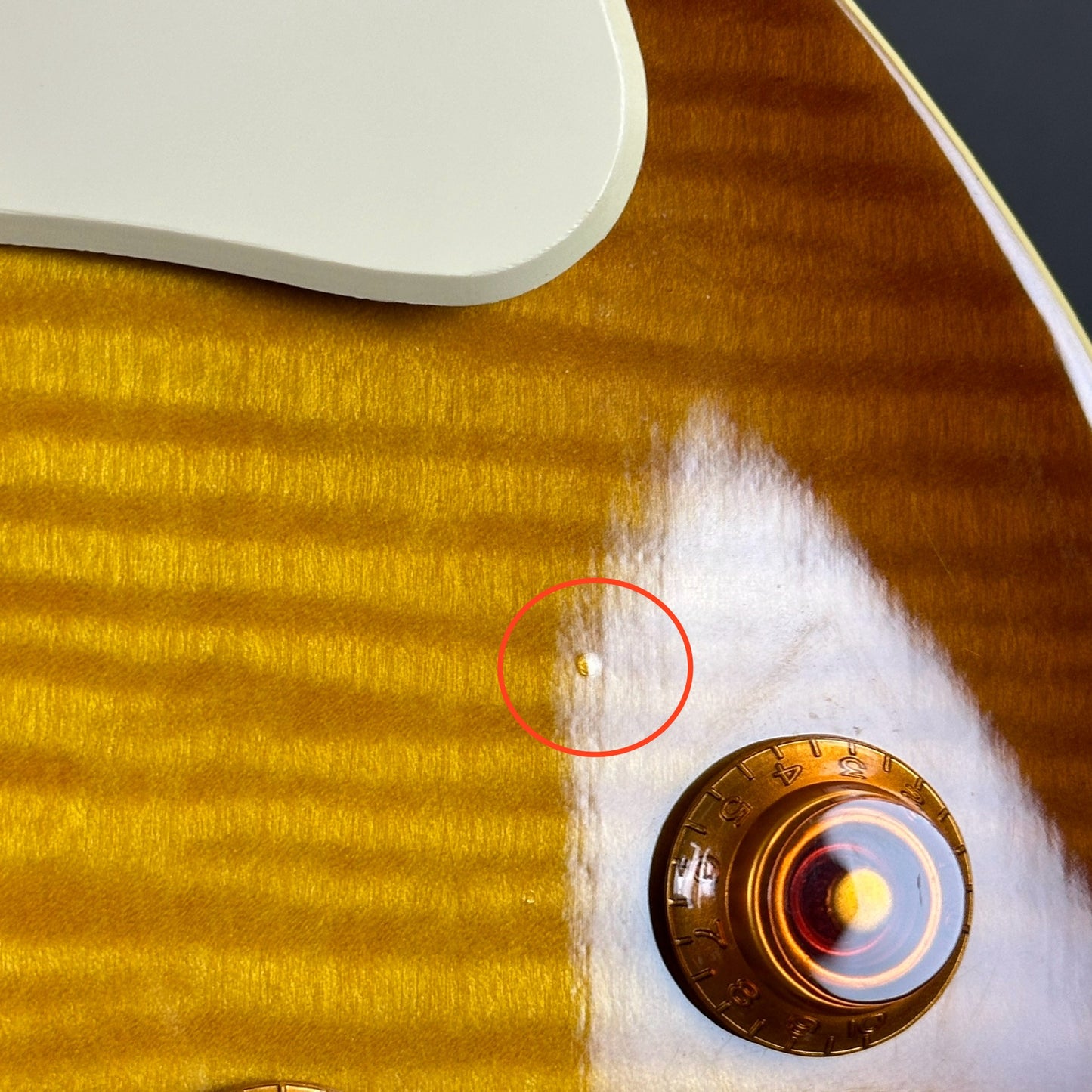 Ding near controls of Used Epiphone Les Paul Standard Honeyburst.