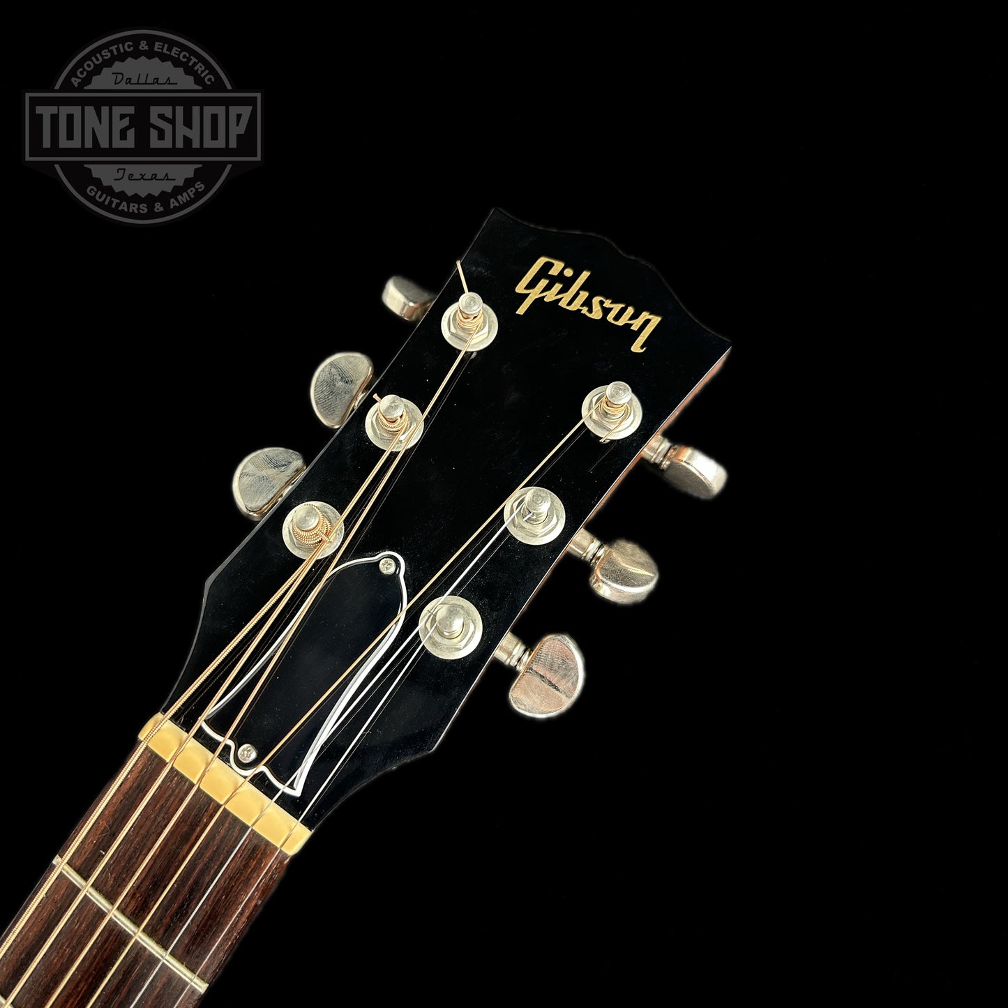 Front of headstock of Used Gibson J-50 Natural.