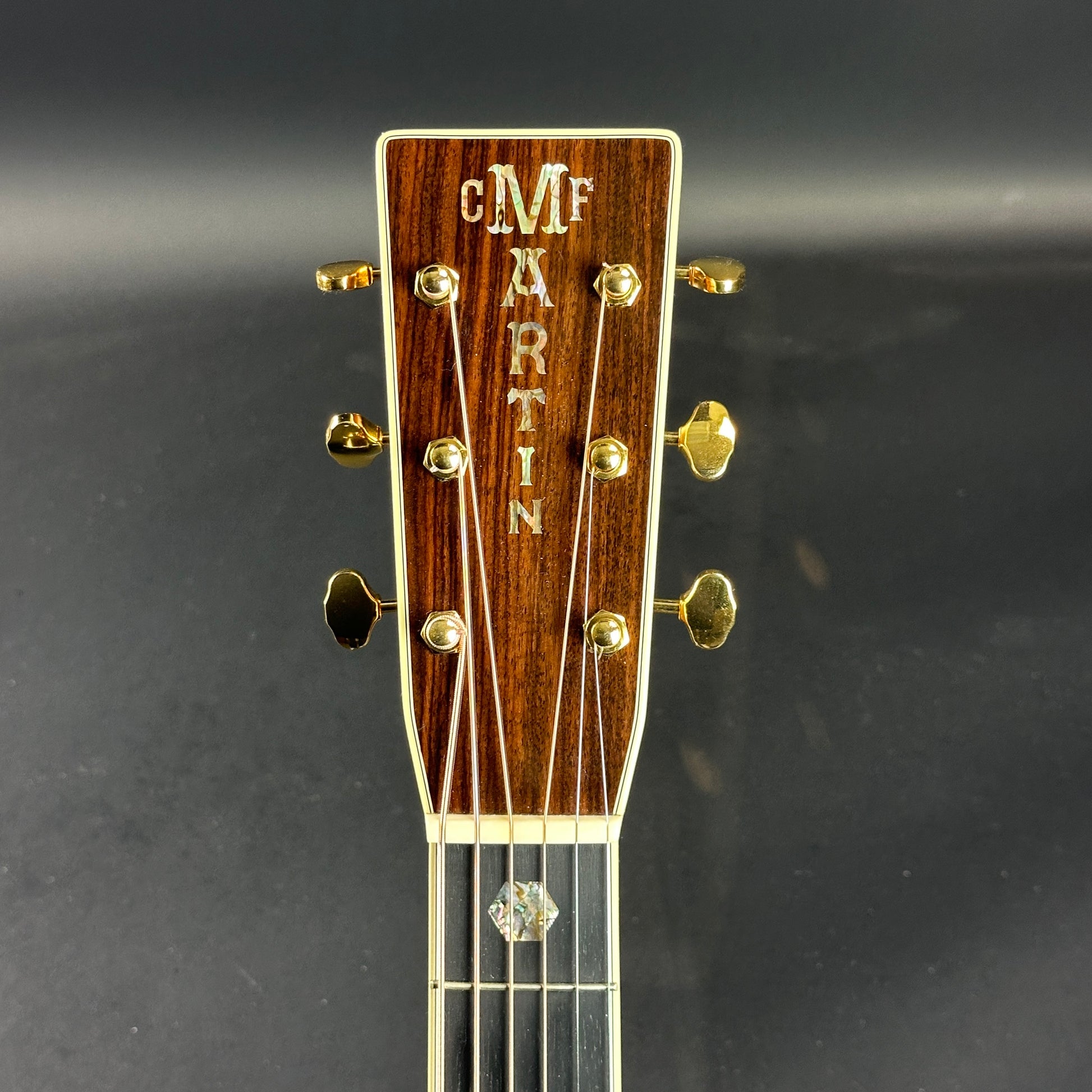 Front of headstock of Used Martin J-40 Natural.