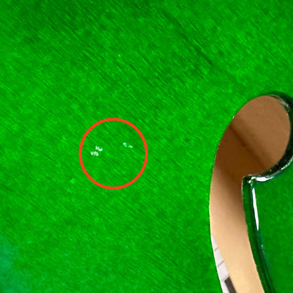 Small dings near F hole of Used Guild Starfire IV Green.