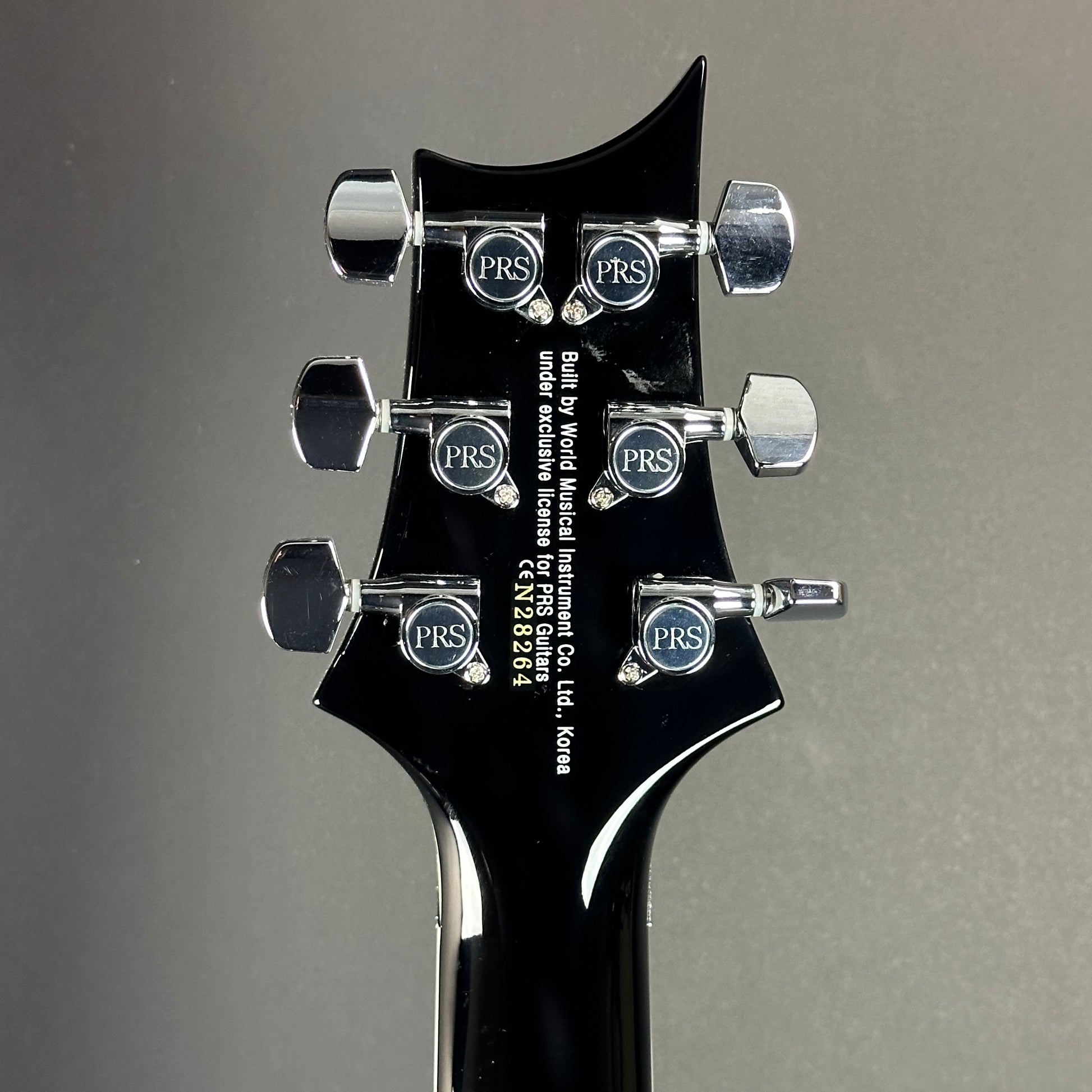 Back of headstock of Used PRS SE Torero Sapphire.