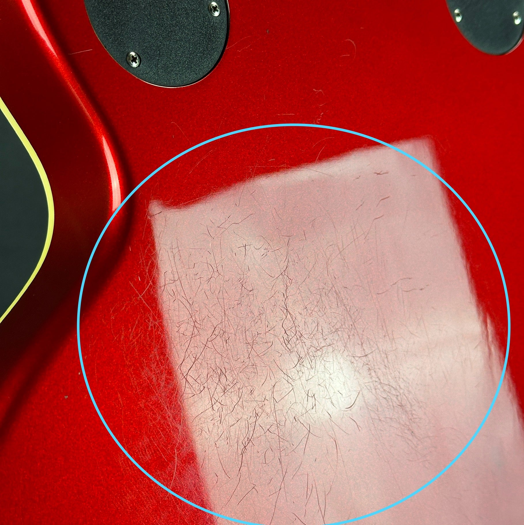 Scratches on back of Used Epiphone Wildcat Red.