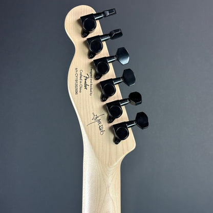 Back of headstock of Used Squier Jim Root Tele Black.