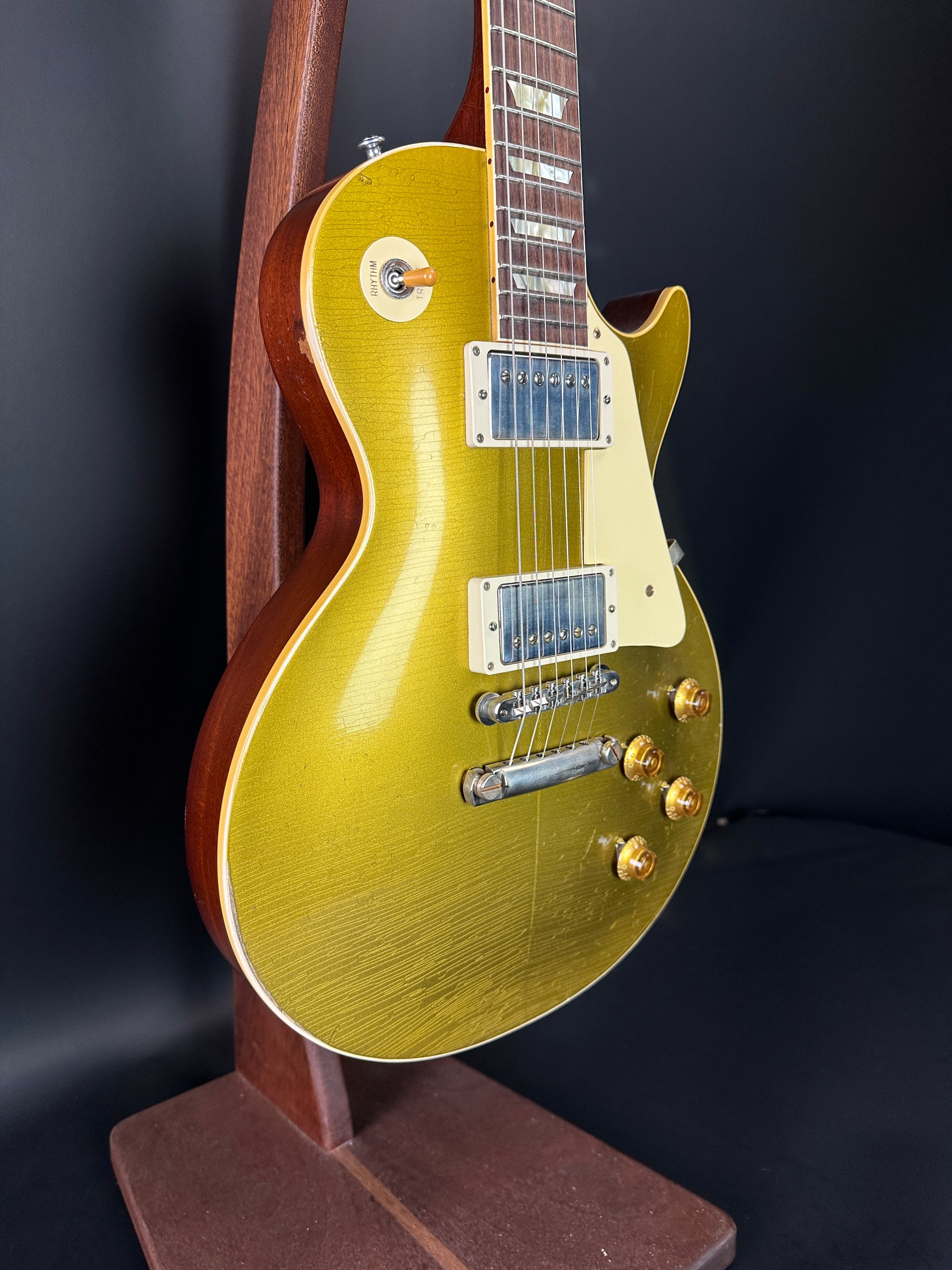 Front angle of Used Gibson Murphy Lab Light Aged Double Gold 1957 Les Paul Goldtop Dark Back.