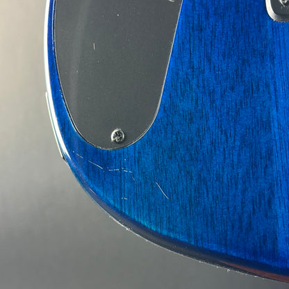 Scratches on back of Used Sterling by MusicMan John Petrucci Quilt Top Trans Blue.