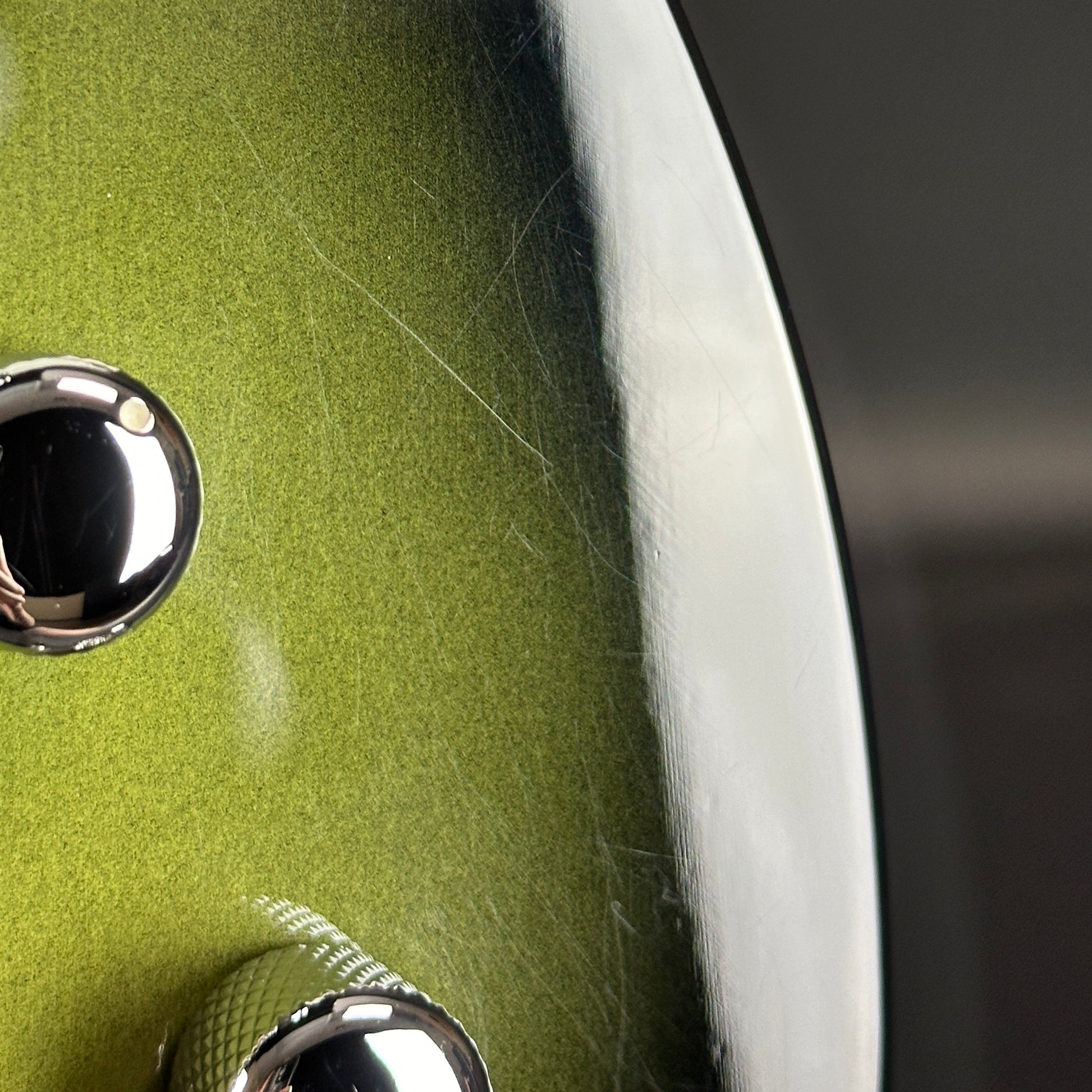 Scratches near controls of Used Reverend Warwick DAW Avocado Burst.