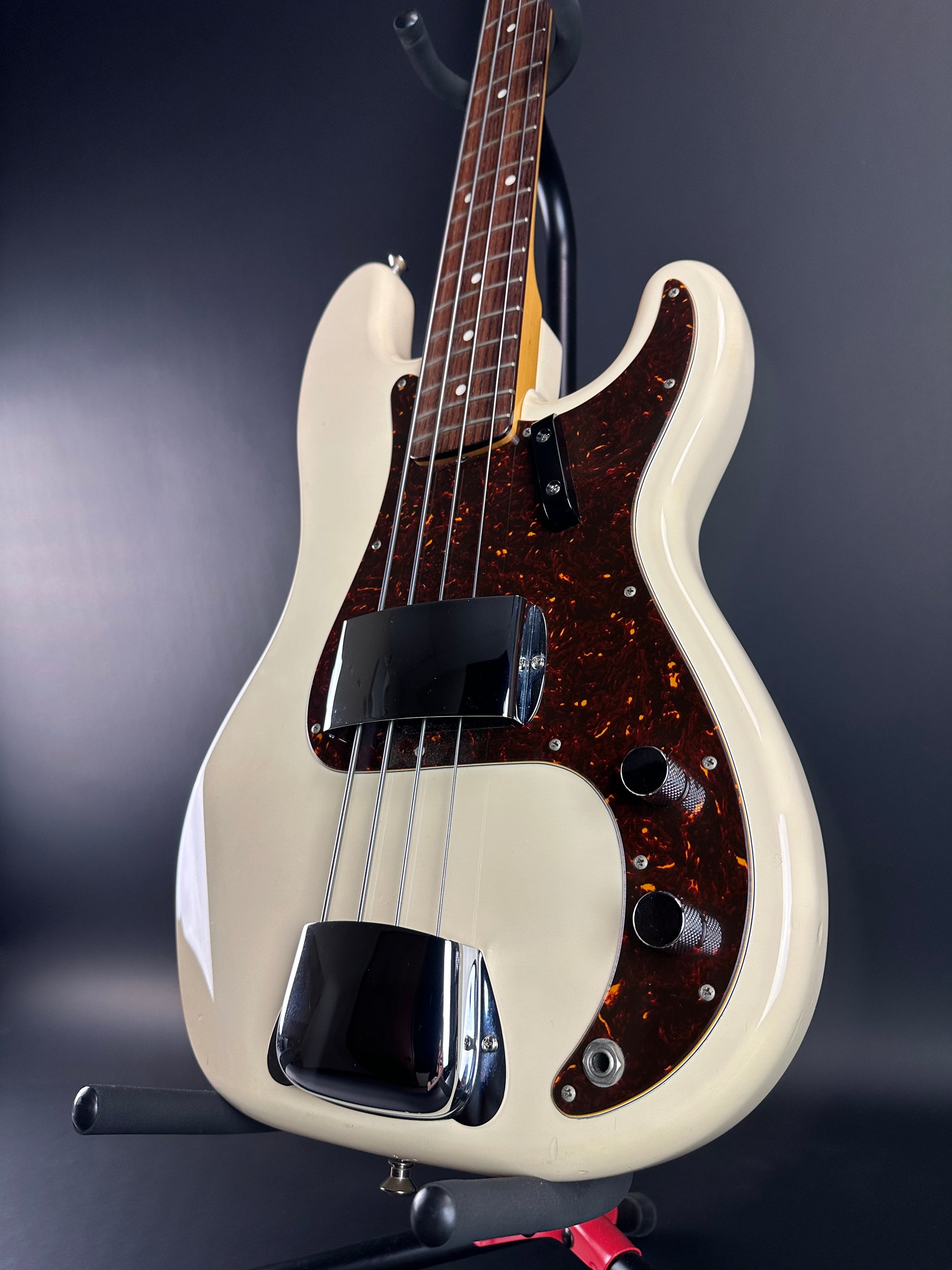 Front angle of Used Fender CIJ PB-64 Precision Bass Olympic White.