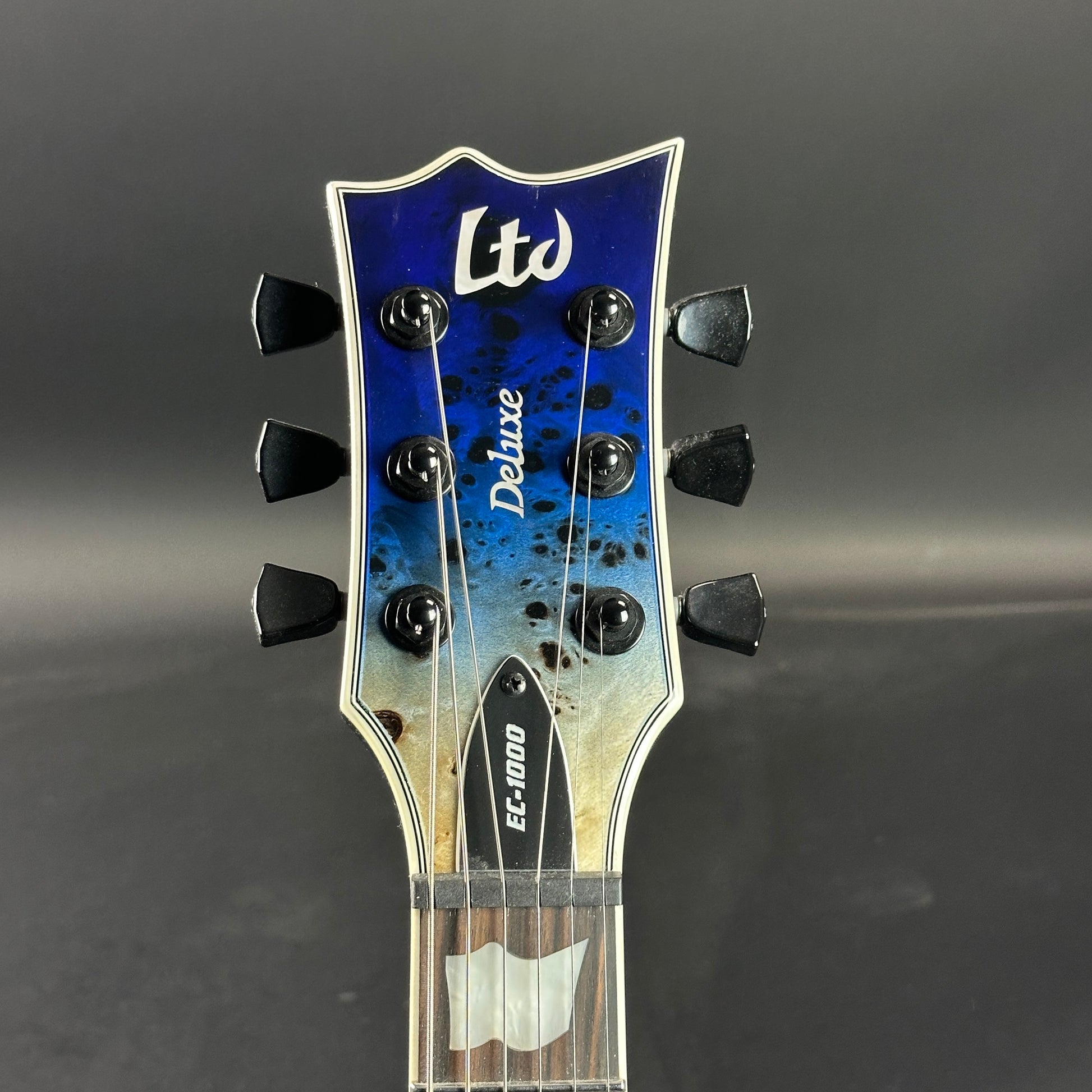 Front of headstock of Used ESP LTD EC-1000 Deluxe Blue Nat Fade.